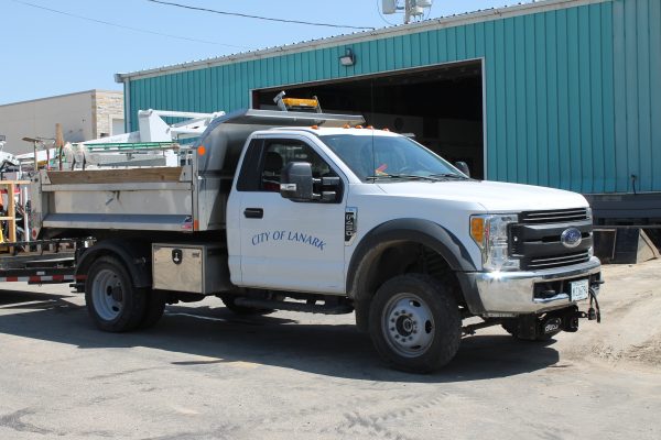A white truck that says "City of Lanark" on it.