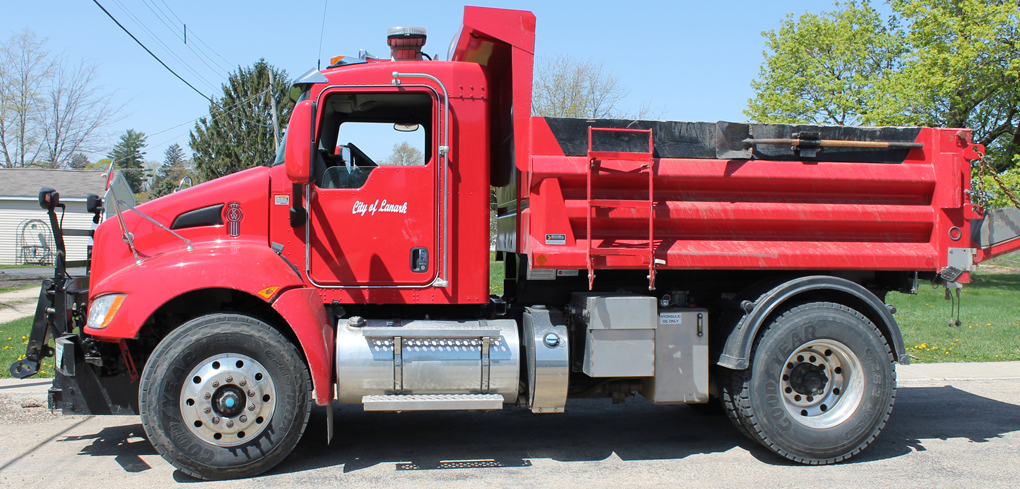 A truck that says "City of Lanark" on it.