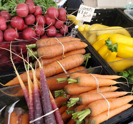 Various vegetables displayed for sale.